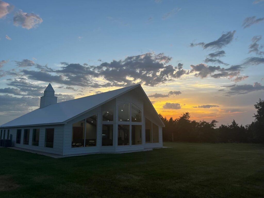 exterior of wedding chapel at sunset
