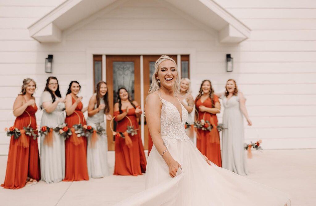 bridesmaids smiling at bride